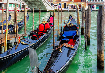 Fototapeta na wymiar Gondolas in the Venetian canal, Italy