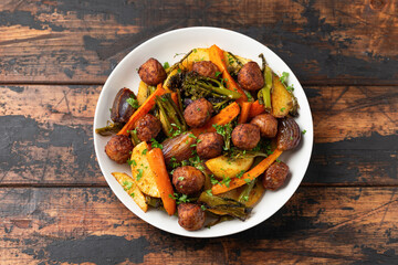 Baked meatballs with Roasted vegetables, potato, carrots, tenderstem broccoli and onions
