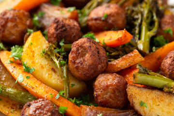 Baked meatballs with Roasted vegetables, potato, carrots, tenderstem broccoli and onions