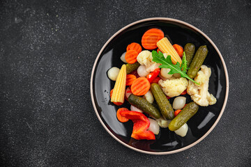 salad vegetable pickled tasty spicy cucumber, gherkin, carrot, onion, cauliflower, pepper appetizer meal food snack on the table copy space food background rustic top view