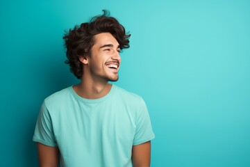 Obraz premium Handsome happy young man studio portrait, bright color background. AI generated