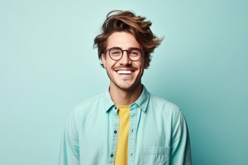 Obraz premium Handsome happy young man in glasses studio portrait, bright color background. AI generated