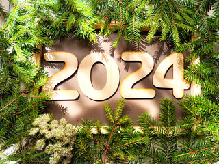 Wooden figures and numbers of the new year 2024 with frame and fir branches of Christmas tree....
