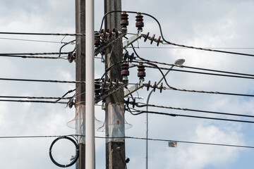 A close-up shot of power lines against the backdrop of the sky. This photo captures an electric...