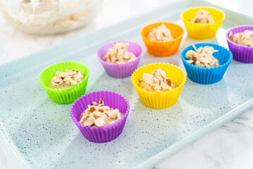 Lemon poppy seed muffins garnished with almond slivers