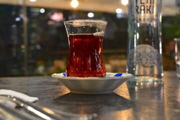Turkish black tea, fudge, figs, walnuts, metal plates and plates, carpet