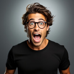 Portrait of a man screaming wow in glasses with a surprised and shocked facial expression on a clean background. Amazed man file stock photo professional photography