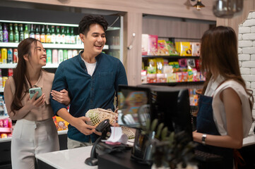 An Asian couple shopping in supermarket , concept of city life lifestyle