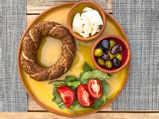 Turkish bagel on plate with tomato and cheese