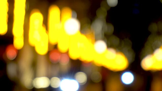 City street neon lights, defocused blurry video images.