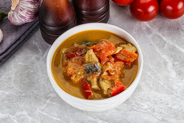 Traditional yellow Thai curry with chicken