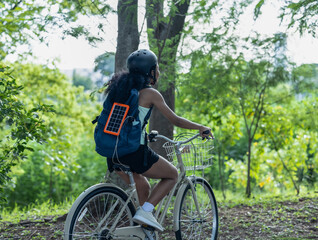Biker fuse eco-awareness, cycling for fitness, solar for device power, and recycling into lifestyle