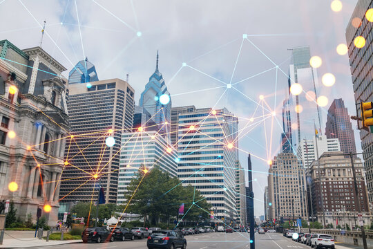 Day time cityscape of Philadelphia financial downtown, Pennsylvania, USA. City Hall neighborhood. Glowing Social media icons. The concept of networking and establishing new connections between people