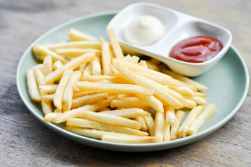 French fries or fried potato , fries with dip or tomato sauce