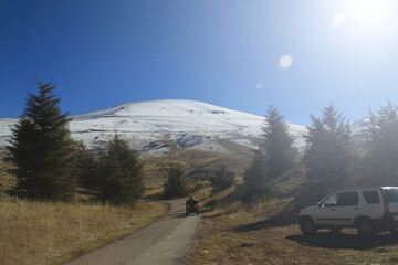 ATV Driving towards Snowy Mountain