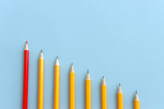 A concept image of different pencils, one is different from the others and stands out from the group