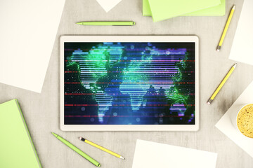 Top view of modern digital tablet monitor with abstract digital world map, research and strategy concept. 3D Rendering