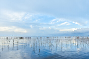The reflections of the clouds in the clear water of the sea