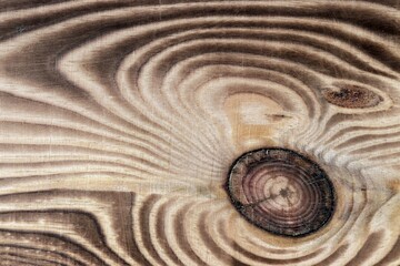 Pine board with a knot and a well-defined structure and texture of wood.