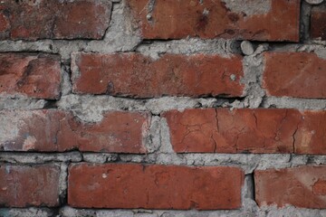 A fragment of careless brickwork made of red brick is depicted.