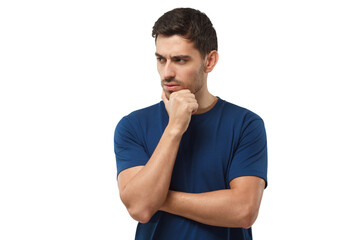 Pensive young man in blue t-shirt thinking, doubt concept