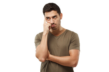 Thoughtful young man in t-shirt, gesturing with hand, solving relationship problem