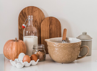 Kitchen still life.  Cooking of seasonal autumn pumpkin pastries. Ingredients, dishes in retro style on a table