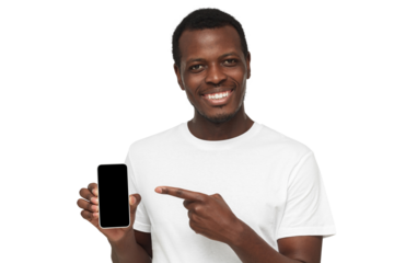 African american man in white t-shirt showing phone and pointing with finger at blank black screen with copy space