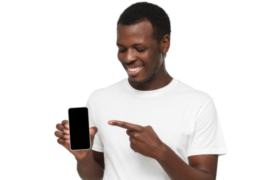Handsome african american man in white t-shirt showing phone and pointing with finger at blank black screen