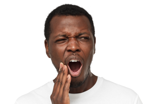Young african american man experiencing strong toothache, pressing hand to chin because of jaw pain