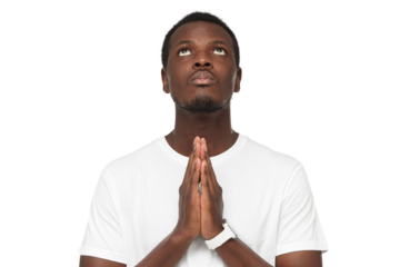 Close-up of young african man praying, putting hands together