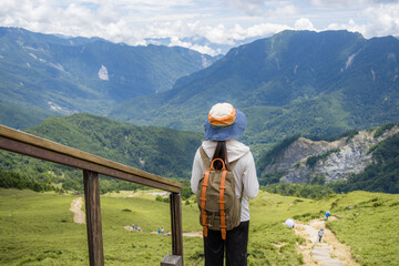 Fototapeta na wymiar Traveler woman relax during a mountain hike