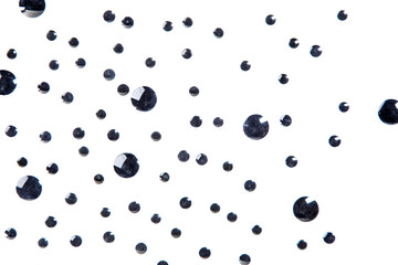 Background of black discs of multiple sizes isolated over white