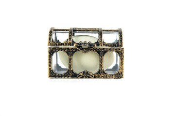 Small gold and glass treasure chest closed with a green egg inside