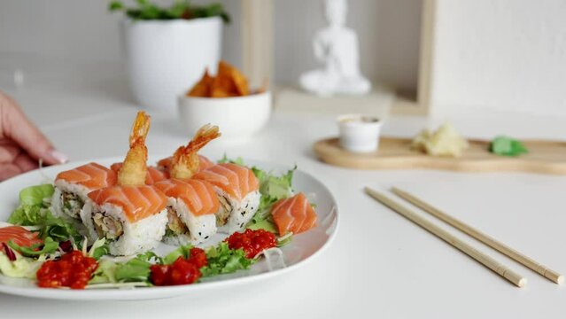 Overhead japanese sushi food. Maki ands rolls with salmon, shrimp, crab and avocado. Top view of assorted sushi, all you can eat menu. Rainbow sushi roll, uramaki, hosomaki and nigiri.