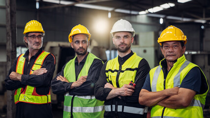 Portrait of Group of Team Mechanical Engineers at Factory Machines. Worker industry collaboration.. .