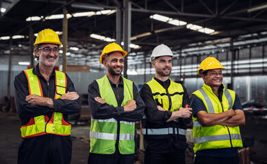 Portrait of Group of Team Mechanical Engineers at Factory Machines. Worker industry collaboration.. .