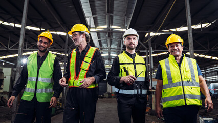 Mechanical Team Operating Machinery in a Manufacturing Workshop. Workers, Equipment, and Quality Control for old factory.