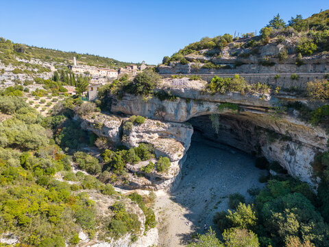 Aerial drone photo of a large canyon and cave in Minerve, France