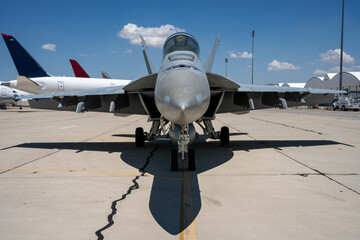 F-18 Hornet fighter jet parked at an airfield.