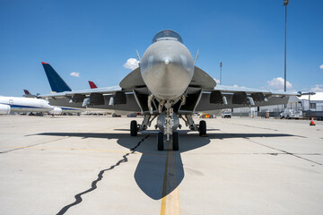 F-18 Hornet fighter jet parked at an airfield.