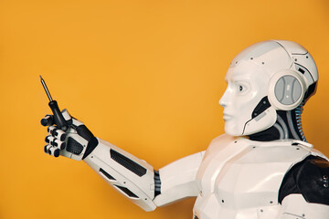 Robot isolated on orange background