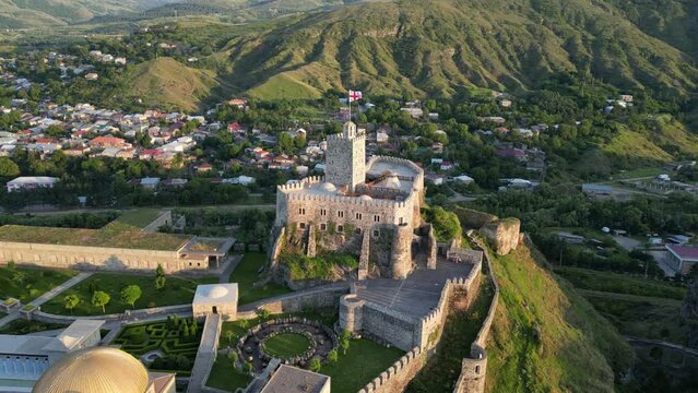 Aerial view of Akhaltsikhe (Rabati) Castle, medieval fortress built in the 9th century. Located in Akhaltsikhe city in southern Georgia. Beautiful mountains and village on the background. Drone shot 
