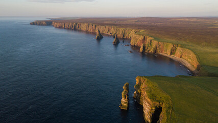 Beautiful rock stacks and stunning landscape of Scotland. Duncansby head are lying near John o...