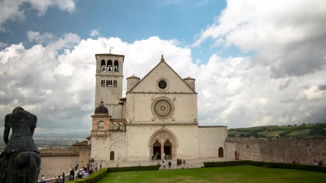 Assisi, Italy - 08 28 2023: time lapse 4k of the papal basilica church of Saint Clare founder of the Poor Clares one of the most famous pilgrimage destinations of Christianity. City of peace. Jubilee