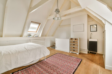 a bedroom with a bed, dressers and tv in the corner area on the left side of the room