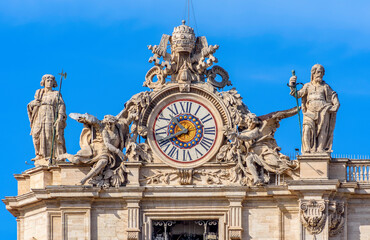 Clock on St. Peter's basilica facade in Vatican - obrazy, fototapety, plakaty