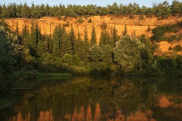 Beautiful autumn scenery. Scenic evening view of Lake and autumn forest. Colorful autumn scene of Greece, Europe. Beauty of nature concept background