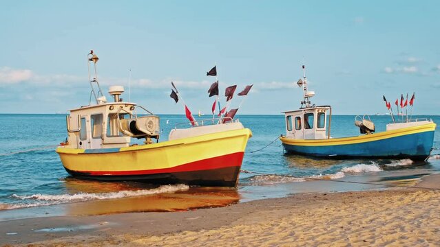 Undecked Handliner Fishing Vessel with Net Flags and Rusty Hooks Purse Sein Equipment Parked on Beach Sand at Seashore on Calm Day