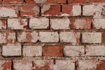 Abstract background of time damaged brick wall.